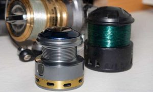 Fishing reel spools with line