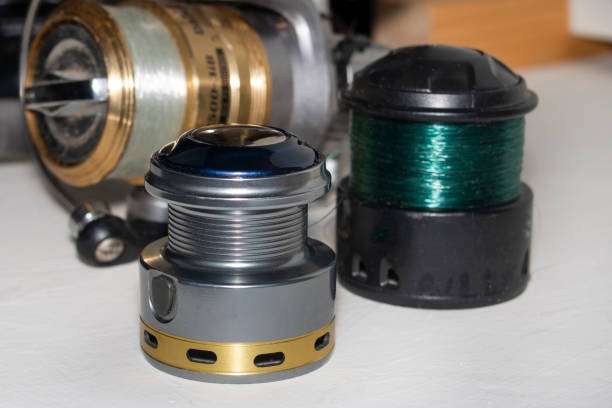 Fishing reel spools with line